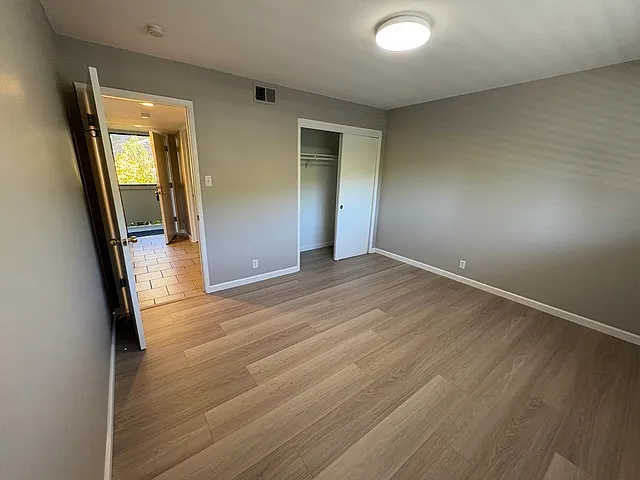 Bedroom:New Oak Laminate just installed, Freshly painted unit,
