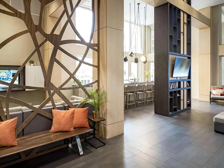 Community Lounge with Decorative Partition, TV, and Bar Seating