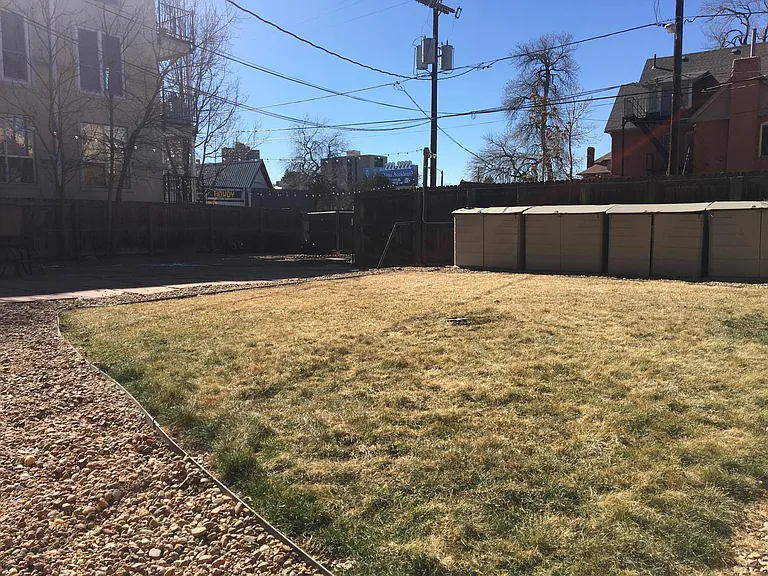 Grass area and separate storage lockers for each apartment
