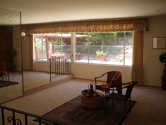 Large living and dining room look out onto backyard
