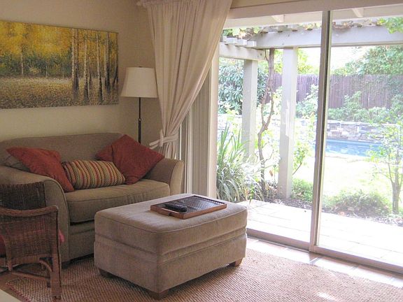 LR with view overlooking pool, garden and private patio