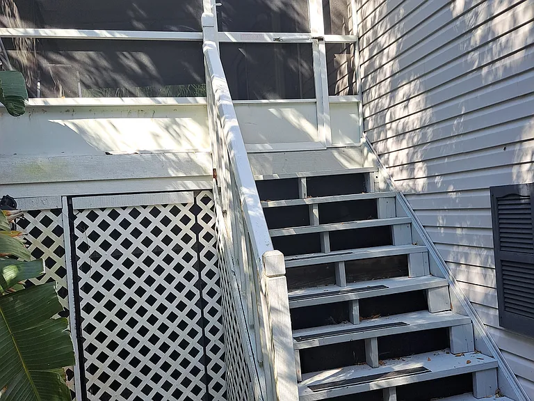 Stairs lead to upstairs unit.