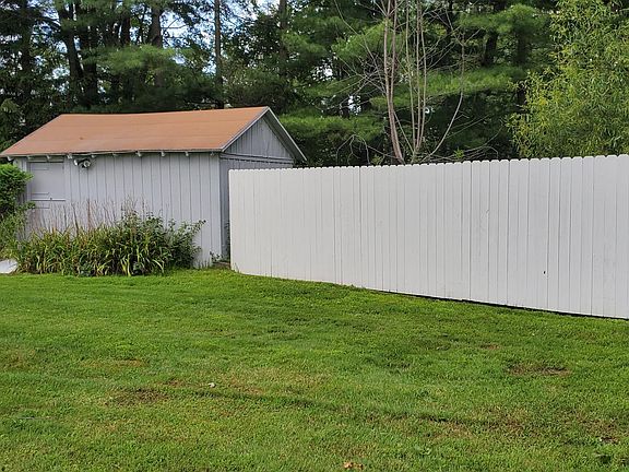 Large Shed a Fence freshly painted
