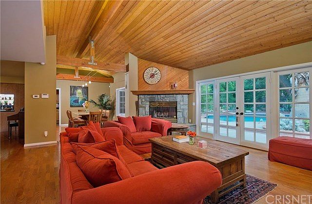 Living Room with Vaulted, Wood Accented, Beamed Ce