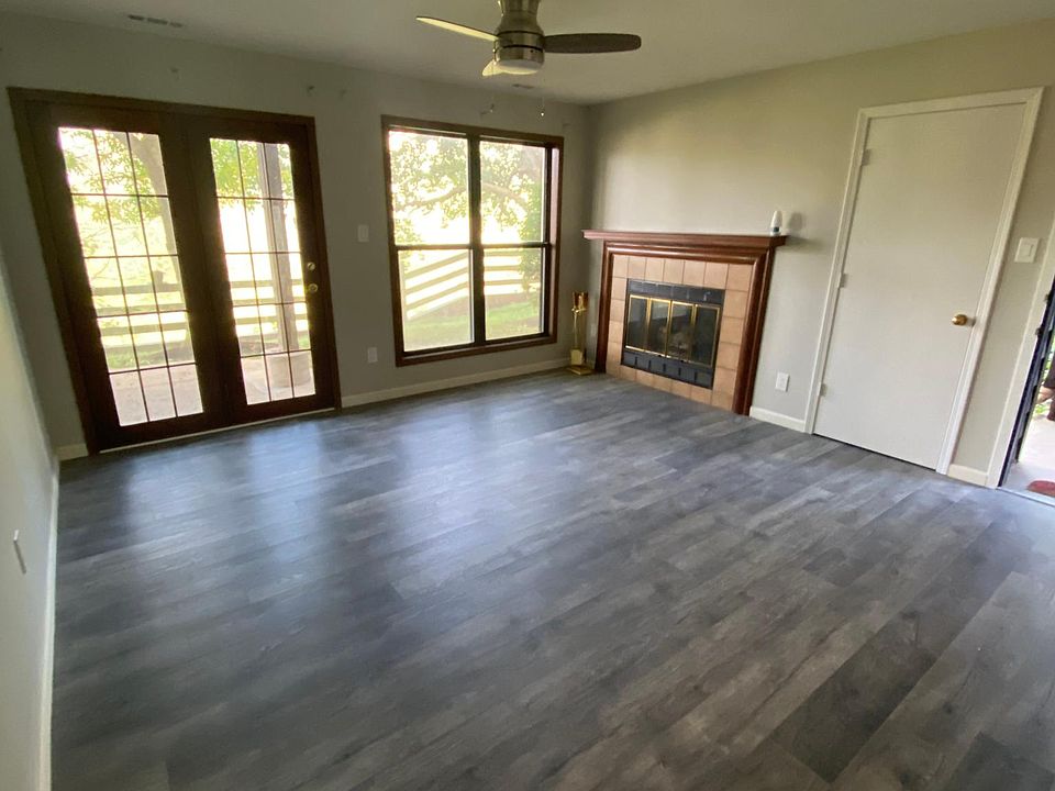 Living room with fireplace and walk out patio