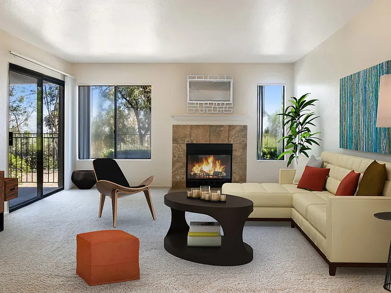 Carpeted Living Room with Fireplace and Balcony
