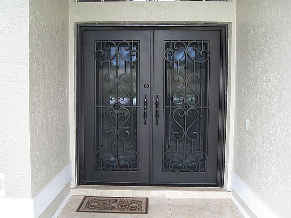 Iron Doors - Tiled Entrance