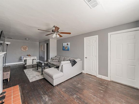 View of living room towards dinning room. Front door far right. Coat closet to the left of front door.