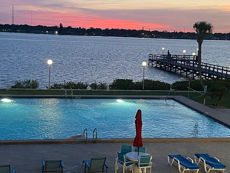 Olympic size heated pool with fishing pier
