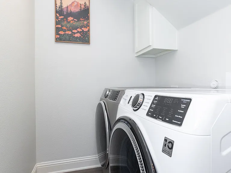 Convenient laundry room equipped with a washer and dryer_making long stays or travel light easy and hassle-free.