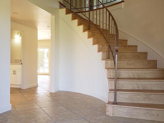 Foyer with a nice curved Staircase