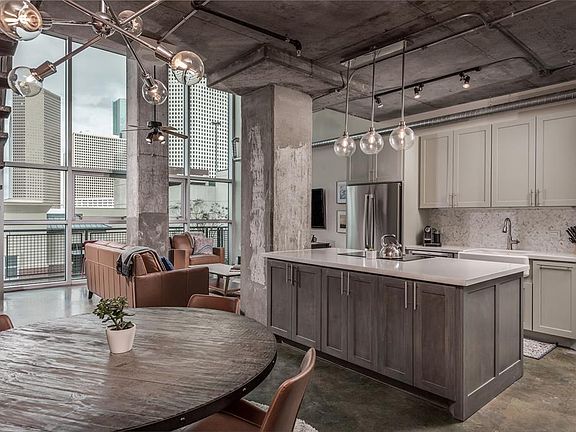 True loft living in walking distance of downtown, midtown, and all in between. On the 7th floor this 2bedroom/2bath unit is industrial, lofty, and laid out beautifully. Notice the downtown skyline through the floor to ceiling windows! Kitchen and bot