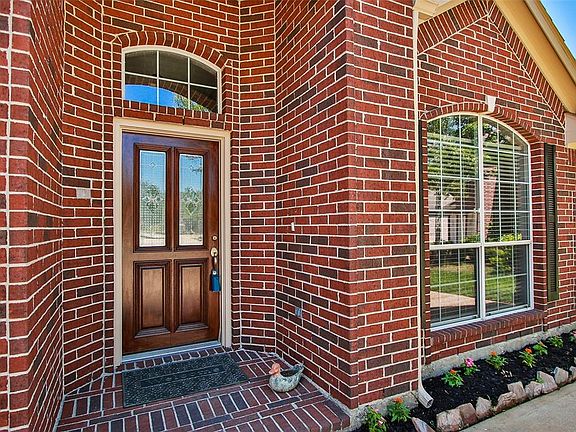 Elegant front door has recently been re-finished.