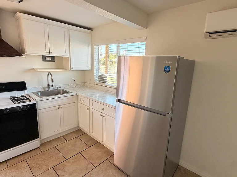 Full kitchen with brand new fridge