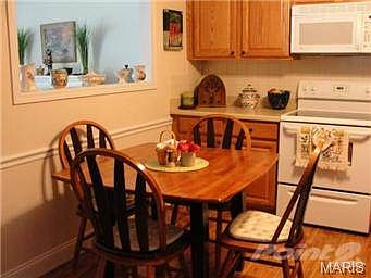 Cut out window between kitchen and living room.
