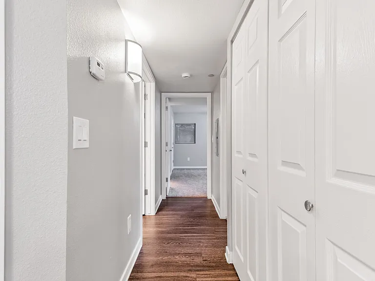 An Interior Hallway at The Buttes Apartments in Loveland, CO