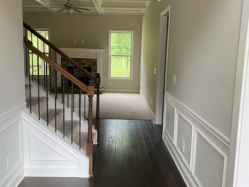 Hardwood floor entrance, wain scotting, Fire Place in Family Room
