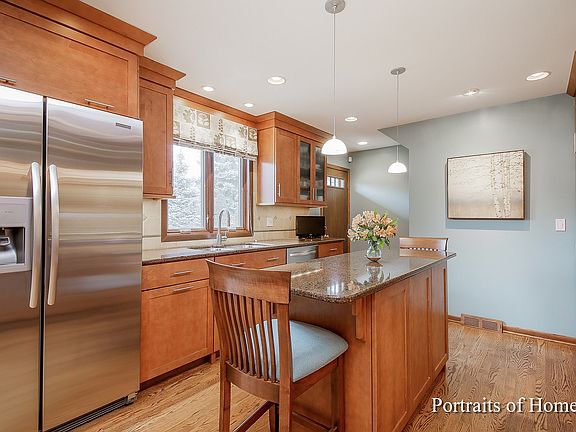 Beautiful custom cabinets feature many pull-outs and drawers for ample storage and organization.