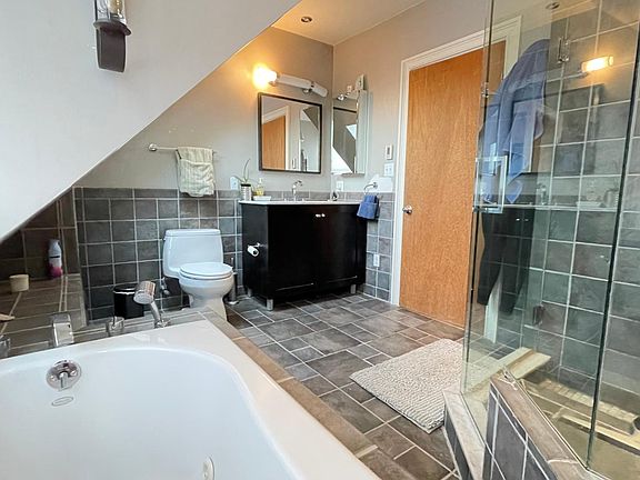 Full Bathroom with Jacazzi and stand glass shower