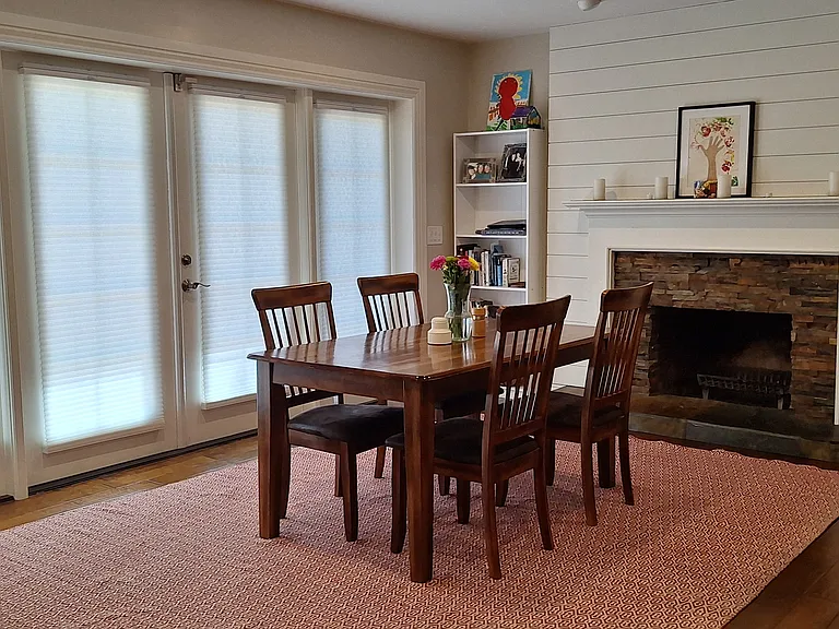 dining room with french doors that open to backyard with trex deck