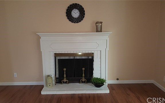 Wood fireplace in Living Room