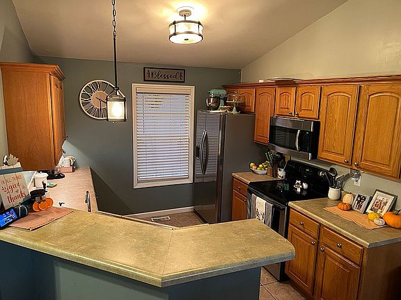 Kitchen with breakfast bar. 