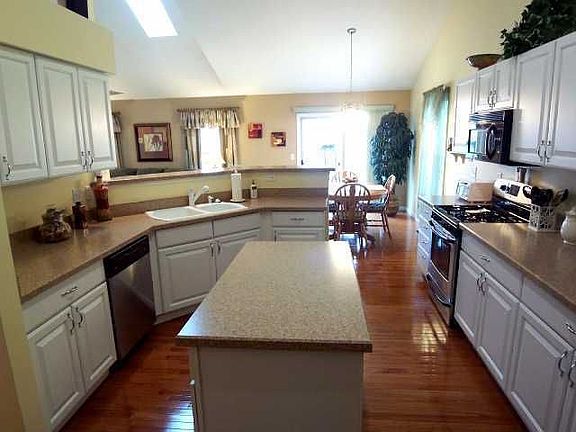 Hardwood floor center island kitchen
