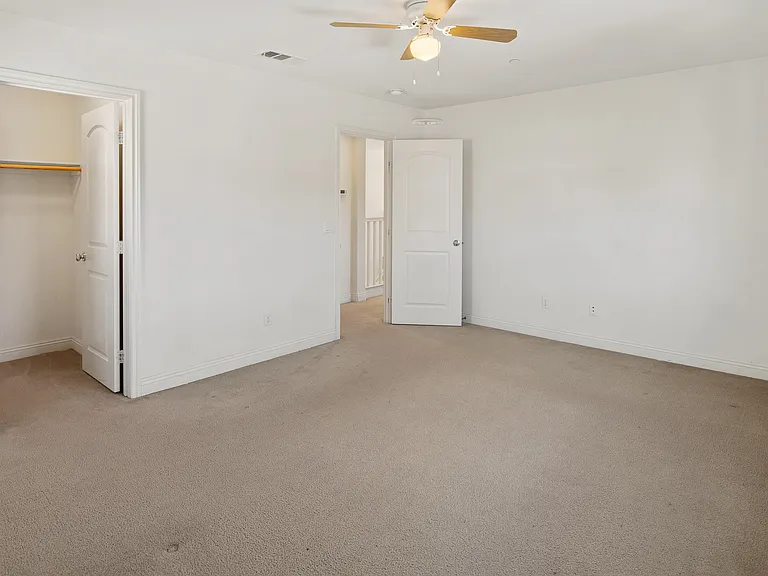Bedroom 2 Upstairs with its own Walking Closet and Fan
