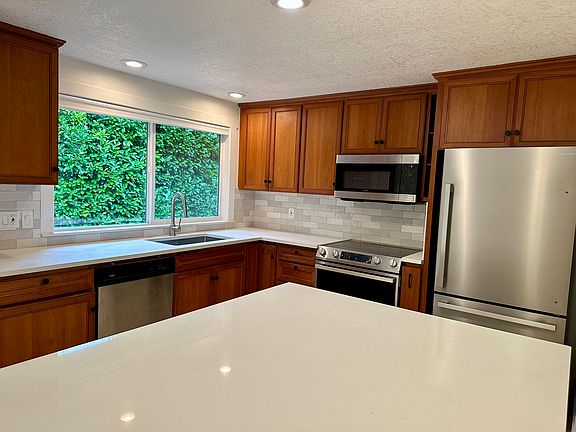 Renovated Kitchen with large size island, quartz countertop and Zellige tile backsplash