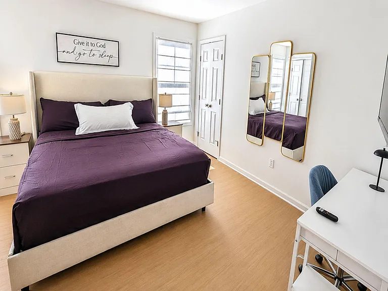Room for 2 with a California Kind Size bed, nightstands, desk space, and 2 closets, 2 windows for natural light.