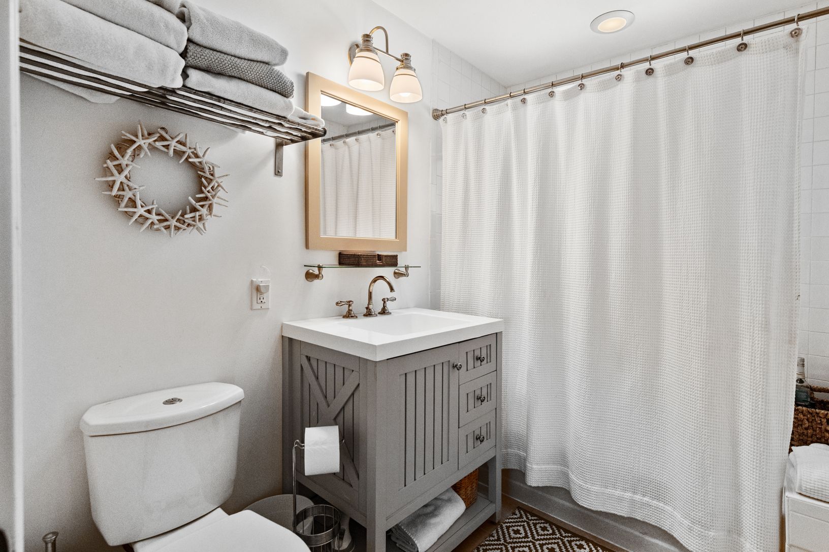  1st floor full bath for bedroom and door to hall to be used also as a powder room