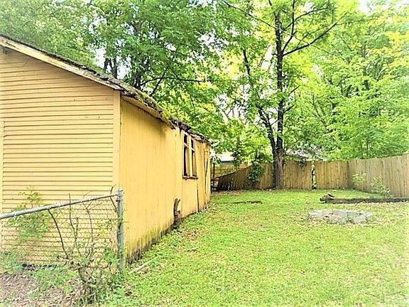 View of garage storage and back fence