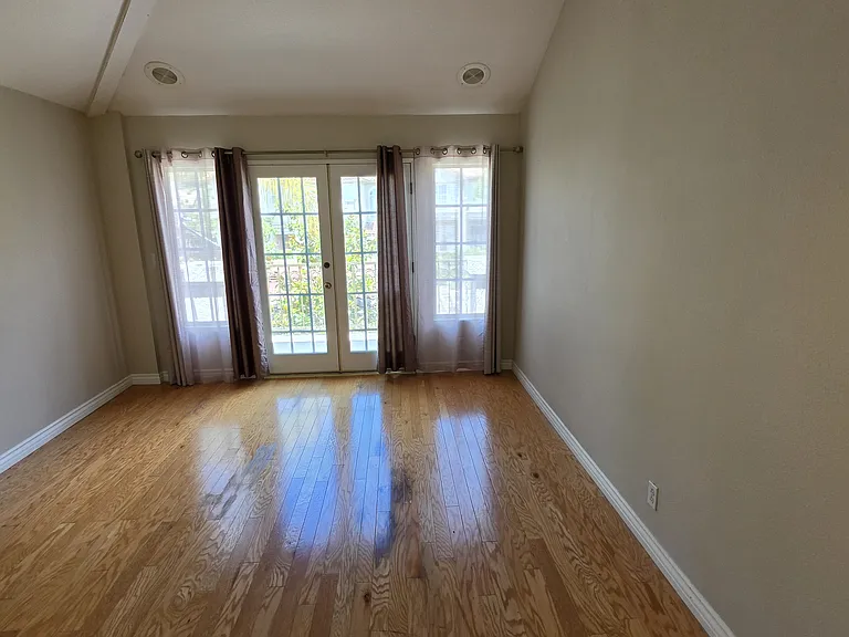 Primary suite with doors leading to deck