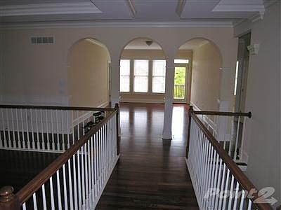 Once inside the door you will see this is no ordinary home. There are ceiling accents, designer arch