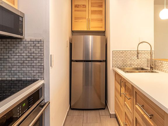 Galley kitchen with brand new appliances