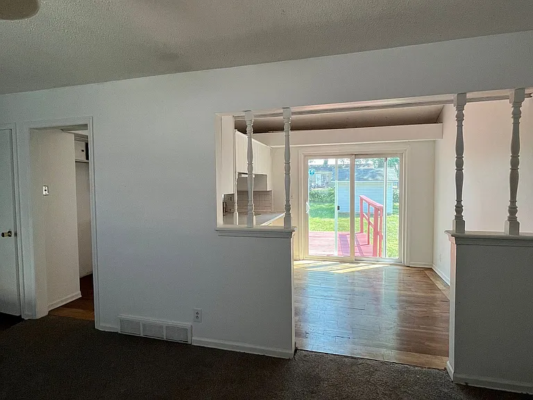View of kitchen and deck from living room
