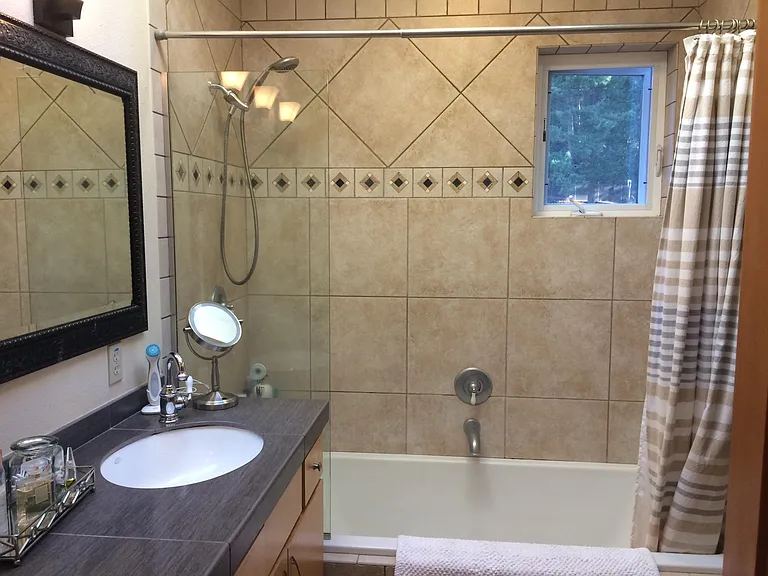 Very large air jet tub, double sinks.