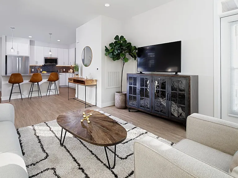 Renovated Package II kitchen, dining, and living areas with hard surface flooring
