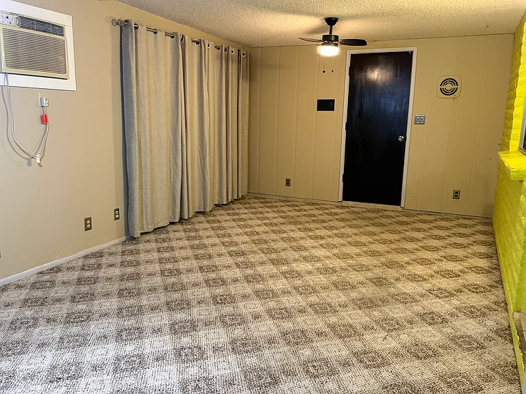 This additional formal dining room area could turned into a second office or media room. The laundry room is just behind the door on the west side of the room. The kitchen is to the right/north of this room.