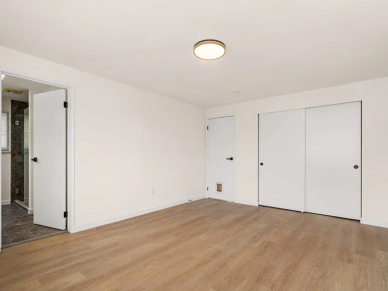 Great-sized master bedroom with a double door closet