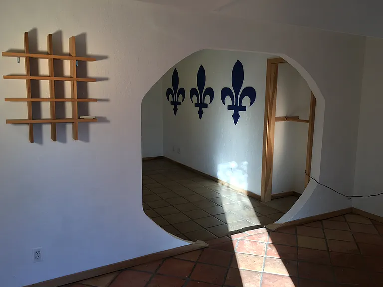 Small side bedroom looking into living room