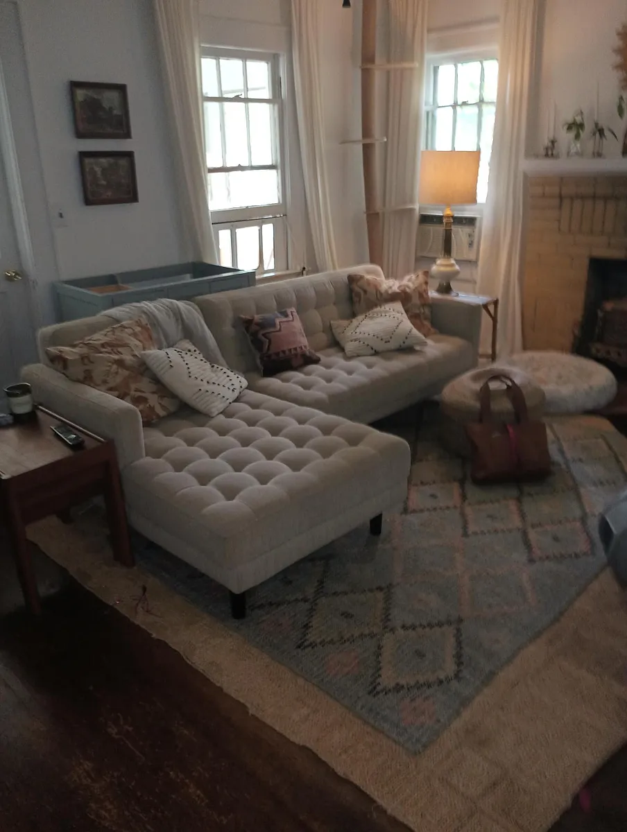 Living Room w/ partial view of yellow brick decorative fireplace. - 295 Norwood Ave NE