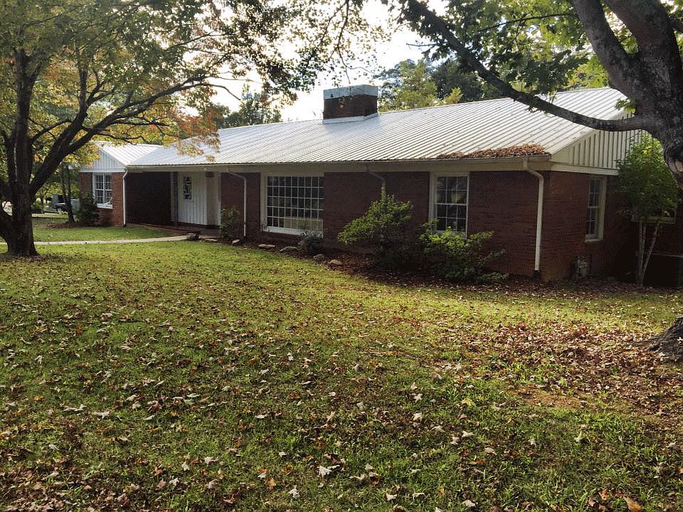 large shaded front yard