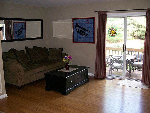 THE LIVING ROOM HAS HARDWOOD FLOOR & SLIDERS TO THE DECK!