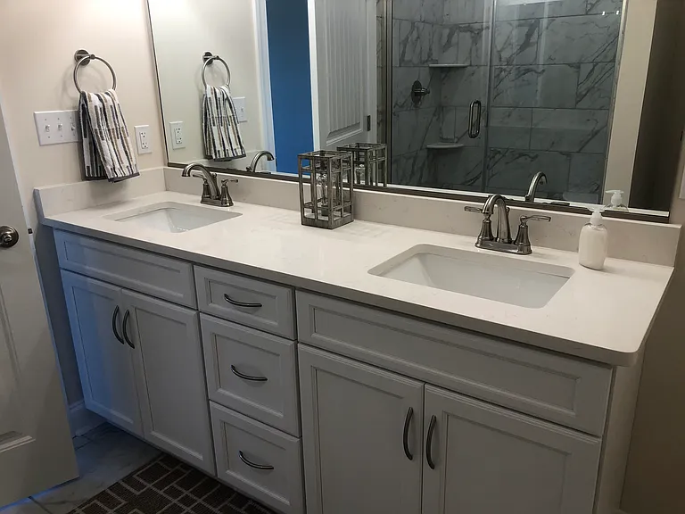 Double sink granite top vanity and tile flooring