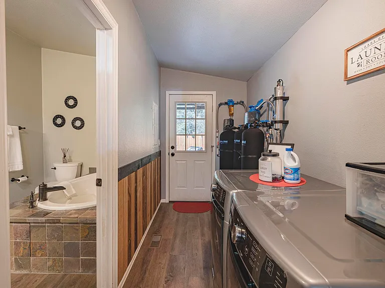 outside of master bathroom laundry room access to outside backyard