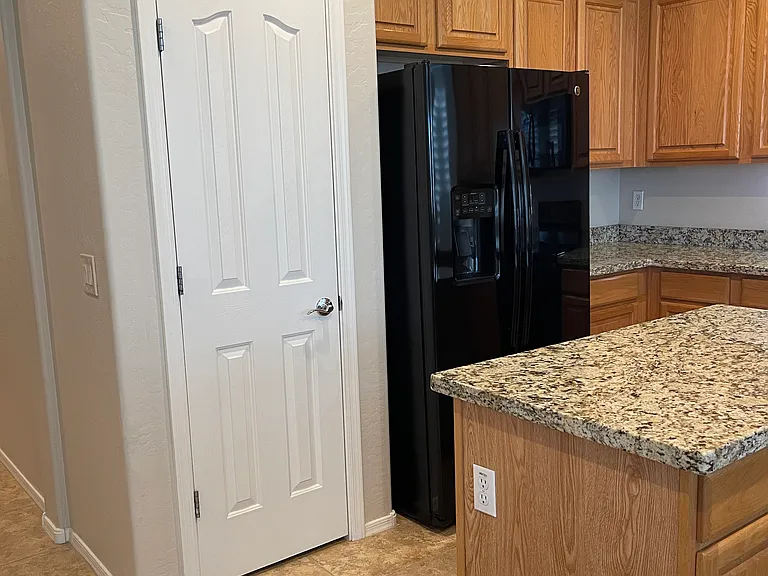 Kitchen pantry and kitchen island.