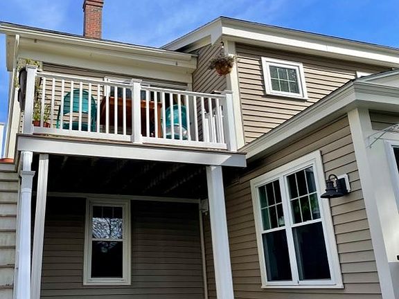 Stairs to access apt, and view of your sunny deck. A gas grill may be located on ground level.