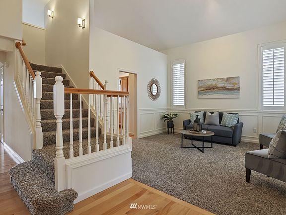 Cathedral entry, very cool plantation shutters in the living room.>
