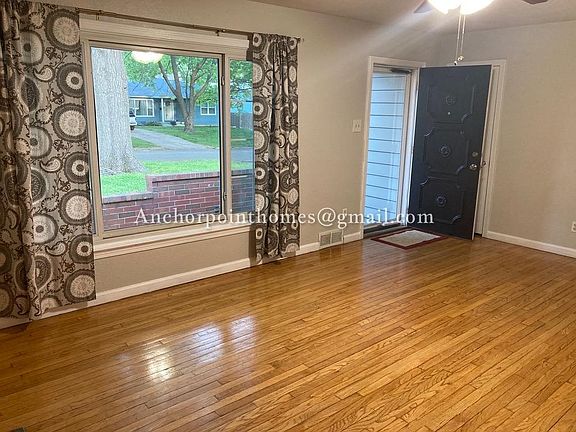 Another view of the living room showing the large picture window